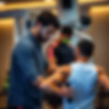 Personal trainer assisting a client at Al Amir Gym