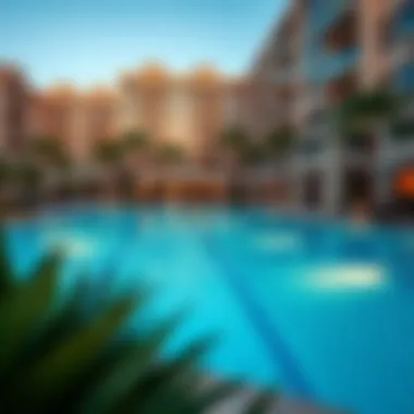 Elegant swimming pool area surrounded by lush landscaping in a luxury apartment complex