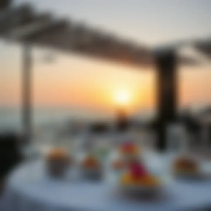 Luxurious beachfront dining setup with gourmet dishes and ocean view
