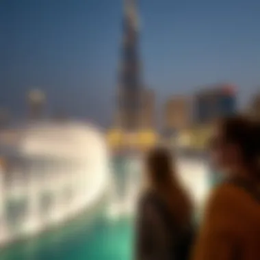 Spectators Enjoying the Show Spectators watching the fountain show with the Burj Khalifa in the background.
